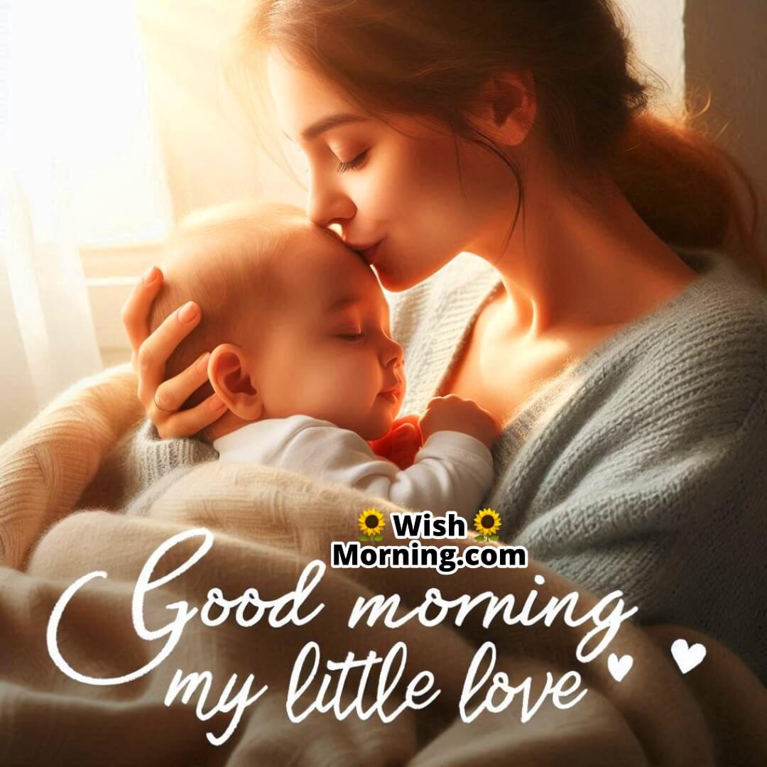 A mother kissing her baby’s forehead in the morning, symbolizing warmth, protection, and pure love.