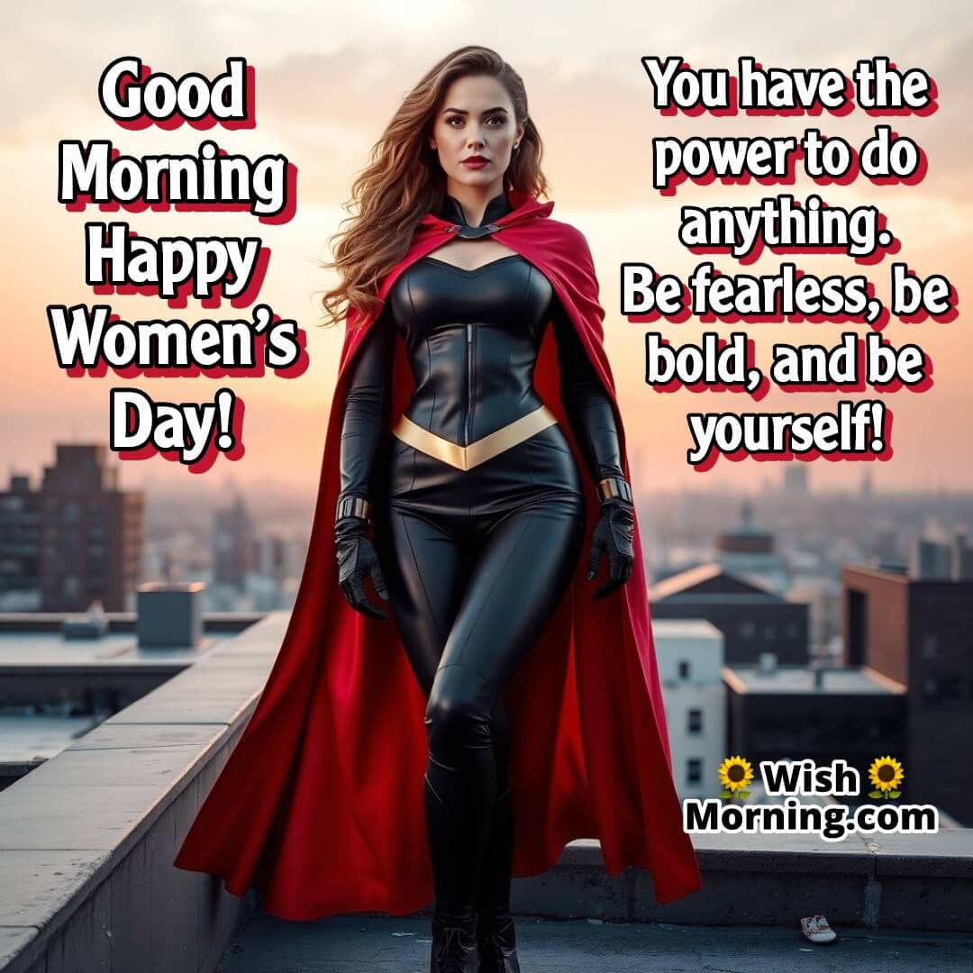 A woman in a red cape on a rooftop at sunrise, radiating strength and determination.